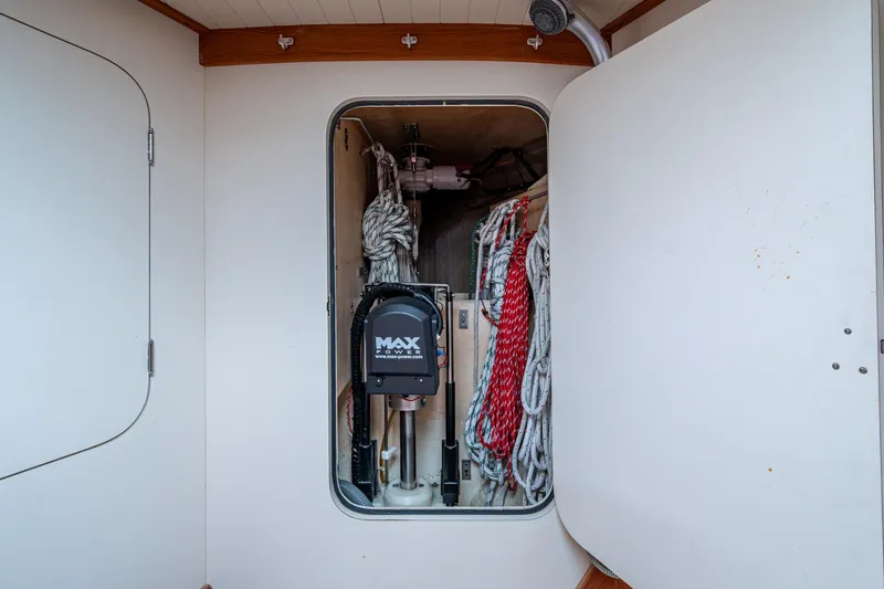 Slide: The Image of Storage compartment on 2000 Hinckley Sou'wester Stoway Sloop with ropes and equipment. - 62