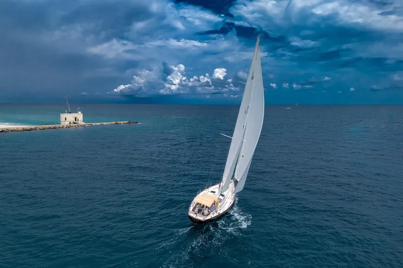 Slide: The Image of Sailing yacht Hinckley Sou'wester Stoway Sloop 2000 on open sea under dramatic sky. - 8