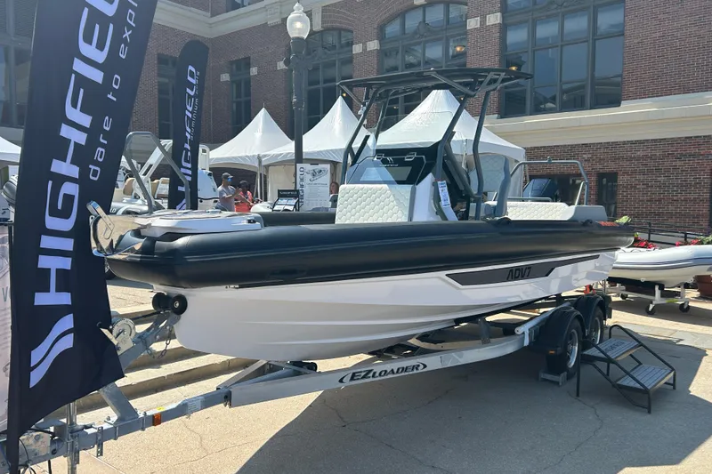 Slide: The Image of Interior of 2026 Highfield ADV 7 boat with hexagonal-patterned seating and sleek table design. - 10