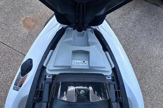 Slide: The Image of 2014 Sea-Doo Wake Pro 215 jet ski with open storage compartment, top view. - 13