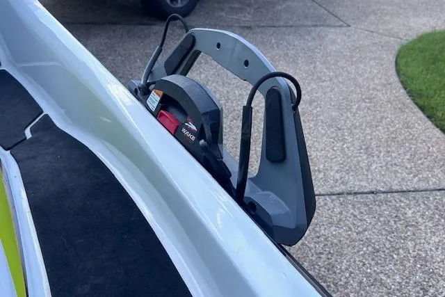 Slide: The Image of 2014 Sea-Doo Wake Pro 215 with wakeboard rack on a textured surface. - 16