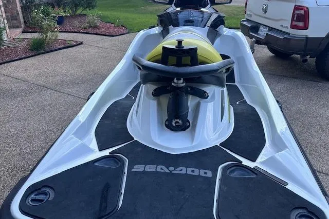 Slide: The Image of 2014 Sea-Doo Wake Pro 215 jet ski parked on driveway. - 5