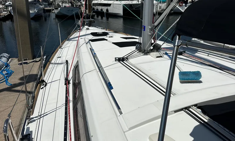 Slide: The Image of 2014 Beneteau Oceanis 41 sailboat docked at marina, showing deck and rigging. - 22