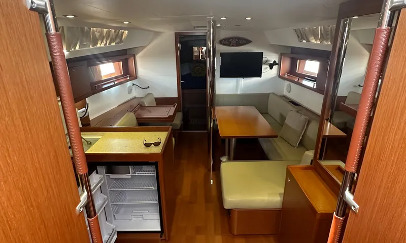 Slide: The Image of Interior of 2014 Beneteau Oceanis 41 yacht with modern kitchen and cozy seating area. - 3
