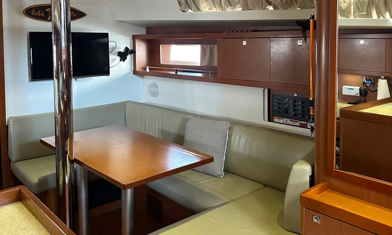 Slide: The Image of Interior of 2014 Beneteau Oceanis 41 yacht with cozy seating and modern amenities. - 7