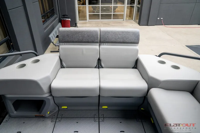 Slide: The Image of 2024 Sea-Doo Switch SPORT 21 interior seating with cup holders, showcasing modern design. - 9