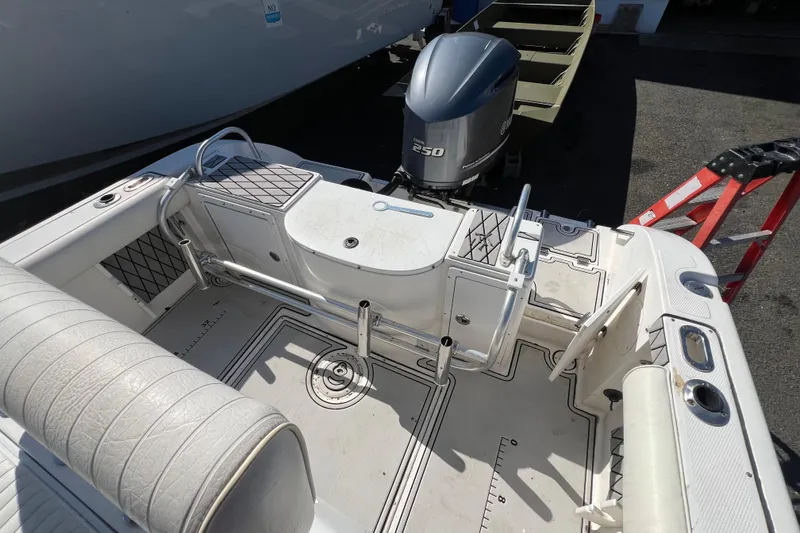 Slide: The Image of 2000 Cobia 224 Center Console boat interior with Yamaha 250 outboard motor. - 4
