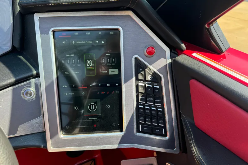 Slide: The Image of 2022 MasterCraft X24 dashboard with touchscreen controls and navigation buttons. - 12
