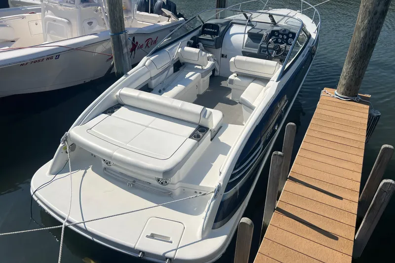 The Image of 2018 Formula 270 Sun Sport boat docked, featuring spacious seating and sleek design. - 0