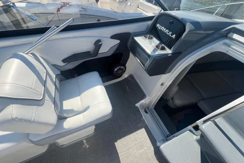 Slide: The Image of 2018 Formula 270 Sun Sport boat interior with seating and cabin entrance. - 17