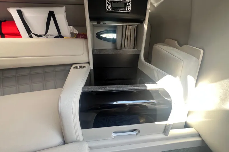 Slide: The Image of Interior of a 2018 Formula 270 Sun Sport boat, featuring seating and storage compartments. - 19