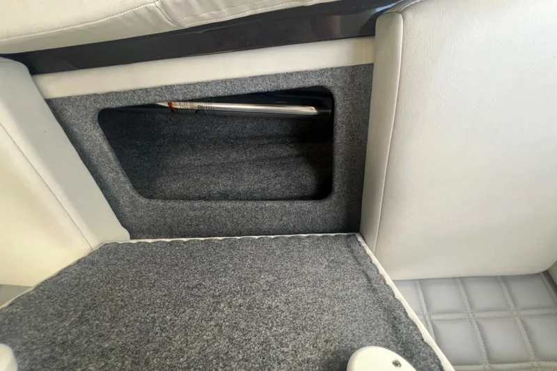 Slide: The Image of Interior storage compartment of 2018 Formula 270 Sun Sport boat with carpeted finish. - 23