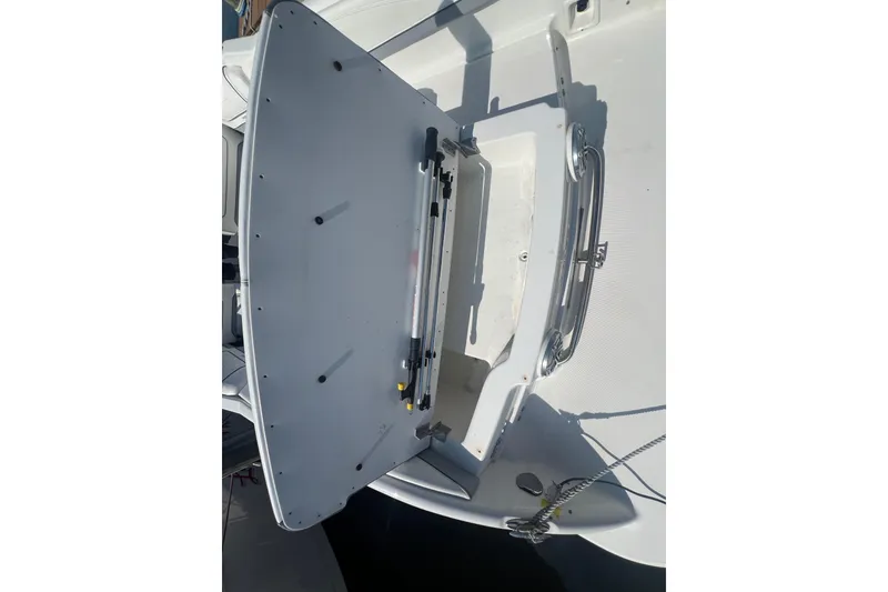 Slide: The Image of 2018 Formula 270 Sun Sport boat with open storage compartment on deck. - 25