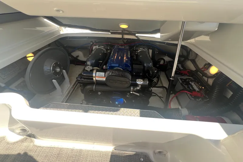Slide: The Image of Engine compartment of a 2018 Formula 270 Sun Sport boat, showcasing detailed components. - 27