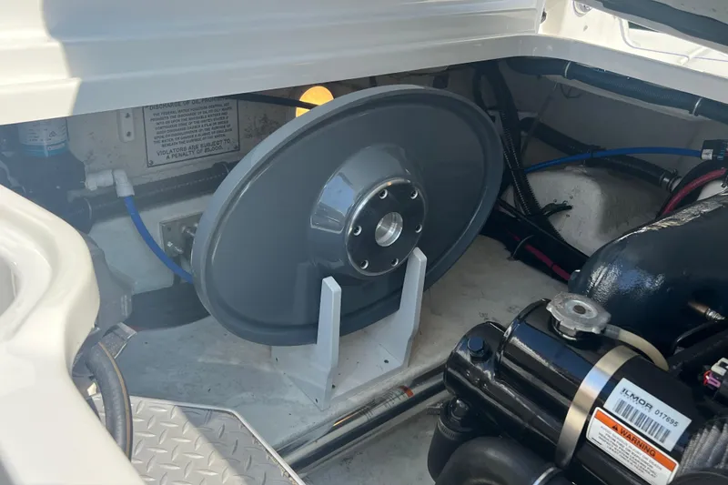 Slide: The Image of Engine compartment of a 2018 Formula 270 Sun Sport boat, showcasing mechanical components. - 29