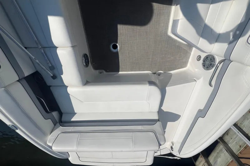 Slide: The Image of 2018 Formula 270 Sun Sport boat interior with white seating and gray flooring. - 6