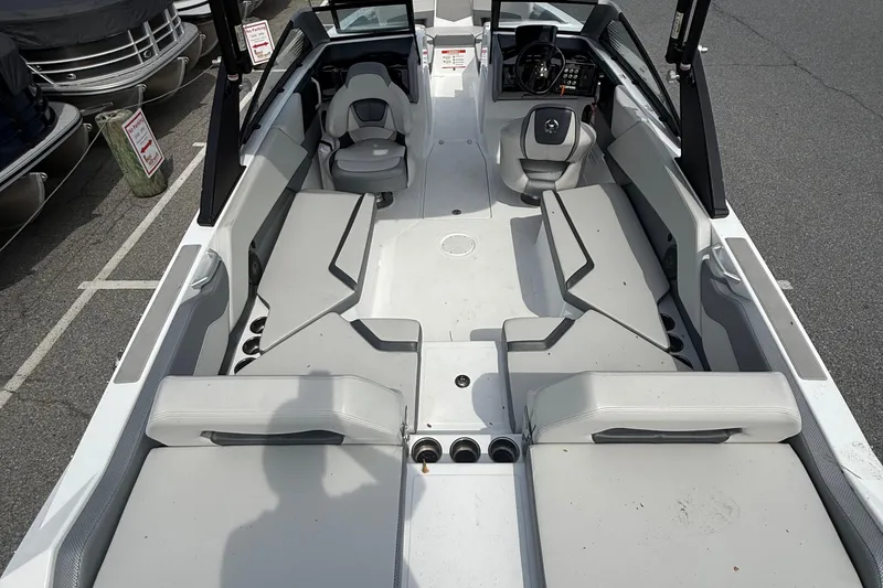 Slide: The Image of 2025 Scarab 235SE boat interior with spacious seating and modern design. - 8