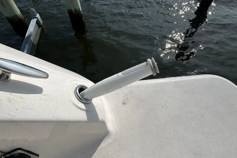 Slide: The Image of 2024 Regal 26 XO boat detail with water reflection and deck cleat. - 26