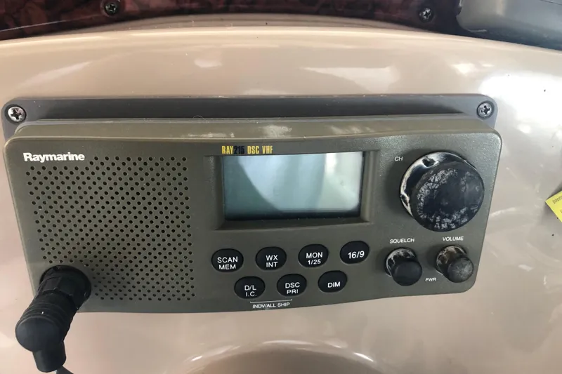 Slide: The Image of Raymarine RAY215 DSC VHF radio on 2004 Sea Ray 280 Sundancer boat dashboard. - 27