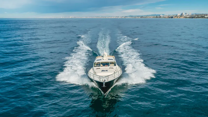 Slide: The Image of 2015 Palm Beach Motor Yachts 45 Sedan cruising on open water. - 16