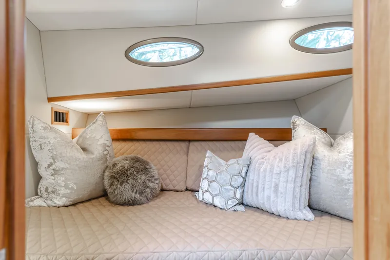 Slide: The Image of Luxurious cabin interior of 2015 Palm Beach Motor Yachts 45 Sedan with plush pillows. - 17