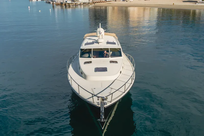 Slide: The Image of 2015 Palm Beach Motor Yachts 45 Sedan cruising on calm waters. - 21