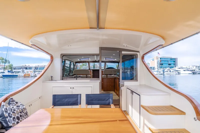 Slide: The Image of 2015 Palm Beach Motor Yachts 45 Sedan, elegant interior, docked at marina. - 22