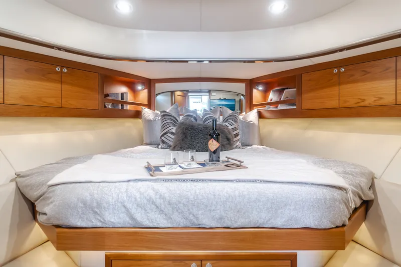 Slide: The Image of Luxurious cabin interior of 2015 Palm Beach Motor Yachts 45 Sedan with cozy bedding. - 33