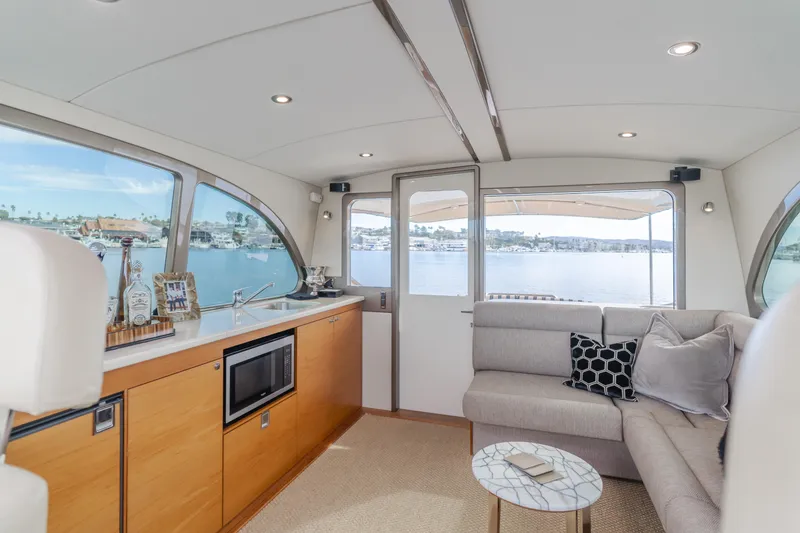 Slide: The Image of Luxurious interior of 2015 Palm Beach Motor Yachts 45 Sedan with waterfront view. - 35