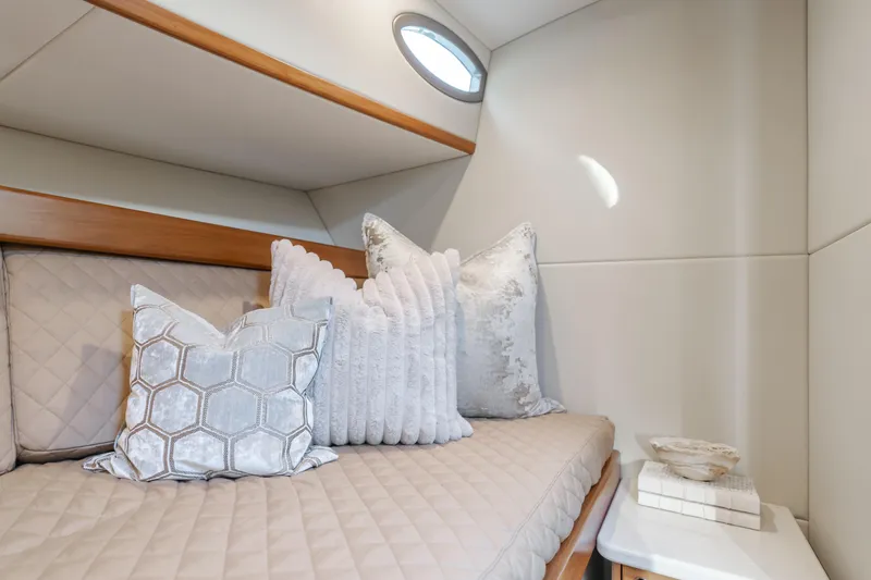 Slide: The Image of Luxurious cabin interior of 2015 Palm Beach Motor Yachts 45 Sedan with plush pillows. - 48