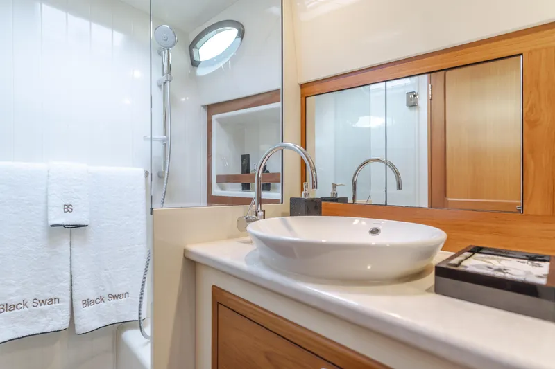 Slide: The Image of Luxurious bathroom in 2015 Palm Beach Motor Yachts 45 Sedan with modern fixtures and elegant design. - 50