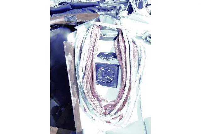 Slide: The Image of 1995 Tartan 3100 sailboat cockpit with ropes and navigation instruments. - 28