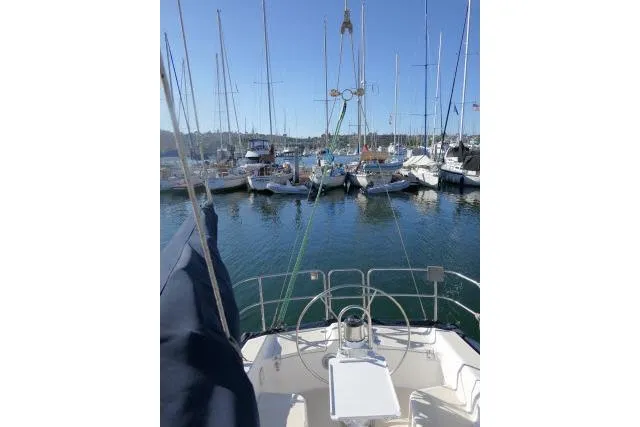 Slide: The Image of Sailboat view from Tartan 3100, 1995 model, docked in a marina with clear skies. - 29