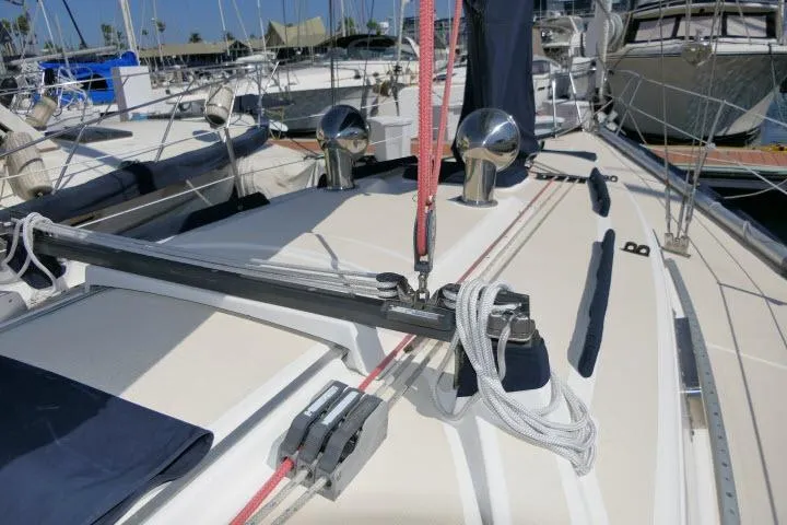 Slide: The Image of 1995 Tartan 3100 sailboat deck with rigging and winches in a marina. - 34
