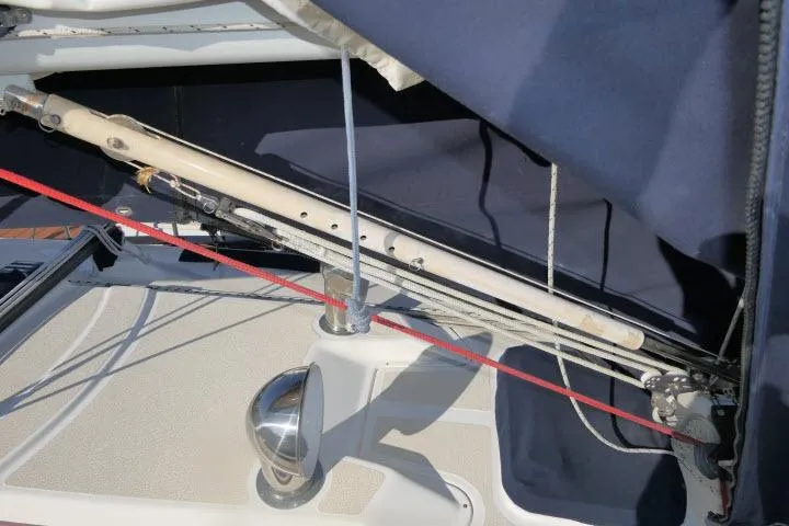 Slide: The Image of Sailboat rigging on a 1995 Tartan 3100, featuring ropes and metal fittings. - 35