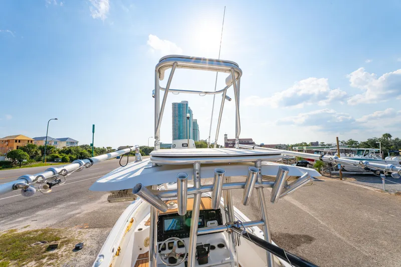 Slide: The Image of 2011 Sea Hunt Gamefish 25 boat on trailer, sunny day, urban background. - 25