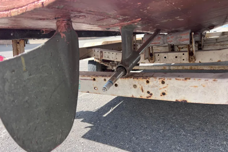Slide: The Image of 1955 Chris-Craft 17 Cavalier boat underside showing rudder and propeller shaft. - 10