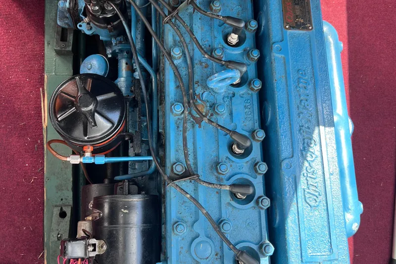 Slide: The Image of 1955 Chris-Craft 17 Cavalier engine, blue with visible wiring and components. - 11