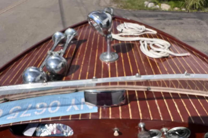Slide: The Image of 1955 Chris-Craft 17 Cavalier boat with polished wood deck and chrome details. - 14