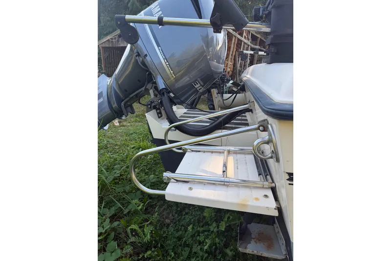 Slide: The Image of 2006 Grady-White Seafarer 228 boat interior with fishing rod holders. - 10