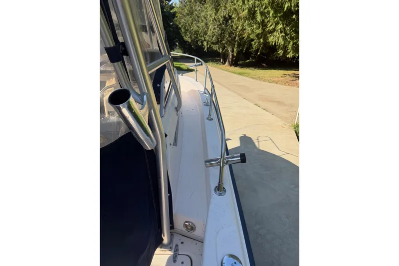 Slide: The Image of 2006 Grady-White Seafarer 228 with Yamaha outboard motor in driveway. - 13