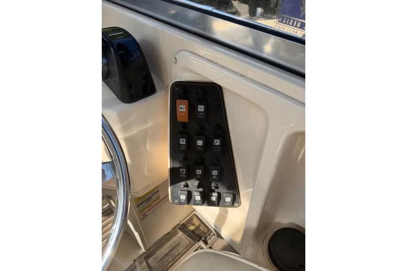 Slide: The Image of Close-up of a 2006 Grady-White Seafarer 228 boat engine part. - 15