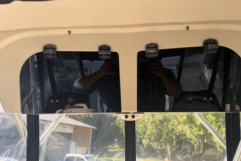 Slide: The Image of 2006 Grady-White Seafarer 228 helm with steering wheel and captain's chair. - 20