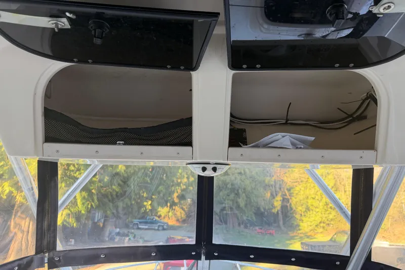 Slide: The Image of Interior view of a 2006 Grady-White Seafarer 228 boat with storage compartments. - 23