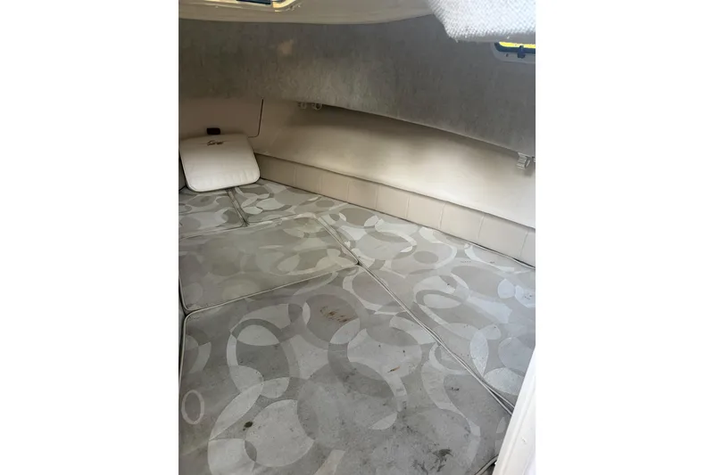 Slide: The Image of 2006 Grady-White Seafarer 228 cabin interior with patterned cushions and compact layout. - 26