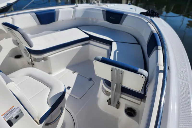 Slide: The Image of 2023 Robalo R230 Center Console boat interior with blue and white seating. - 13