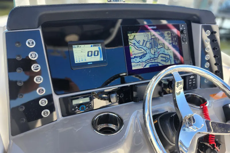Slide: The Image of 2023 Robalo R230 Center Console dashboard with navigation and control systems. - 7