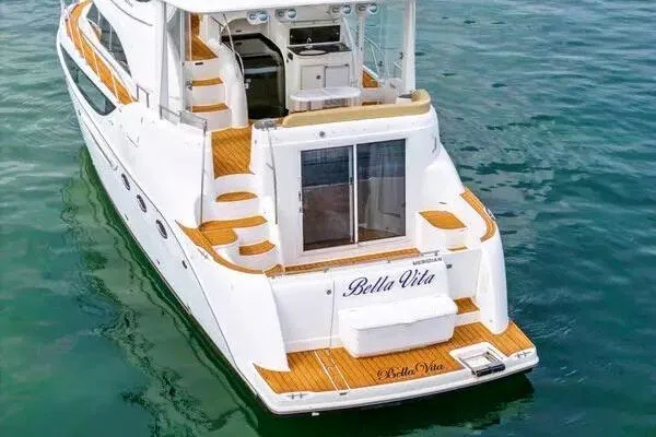 Slide: The Image of 2007 Meridian 459 Motoryacht on water with city skyline backdrop. - 10