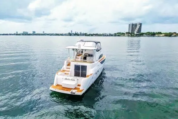 Slide: The Image of 2007 Meridian 459 Motoryacht interior with elegant wood flooring and city skyline view. - 12