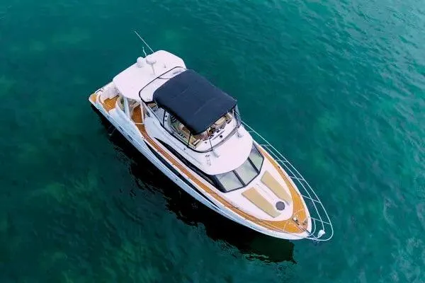 Slide: The Image of Luxurious 2007 Meridian 459 Motoryacht interior with modern kitchen and elegant wood finishes. - 18